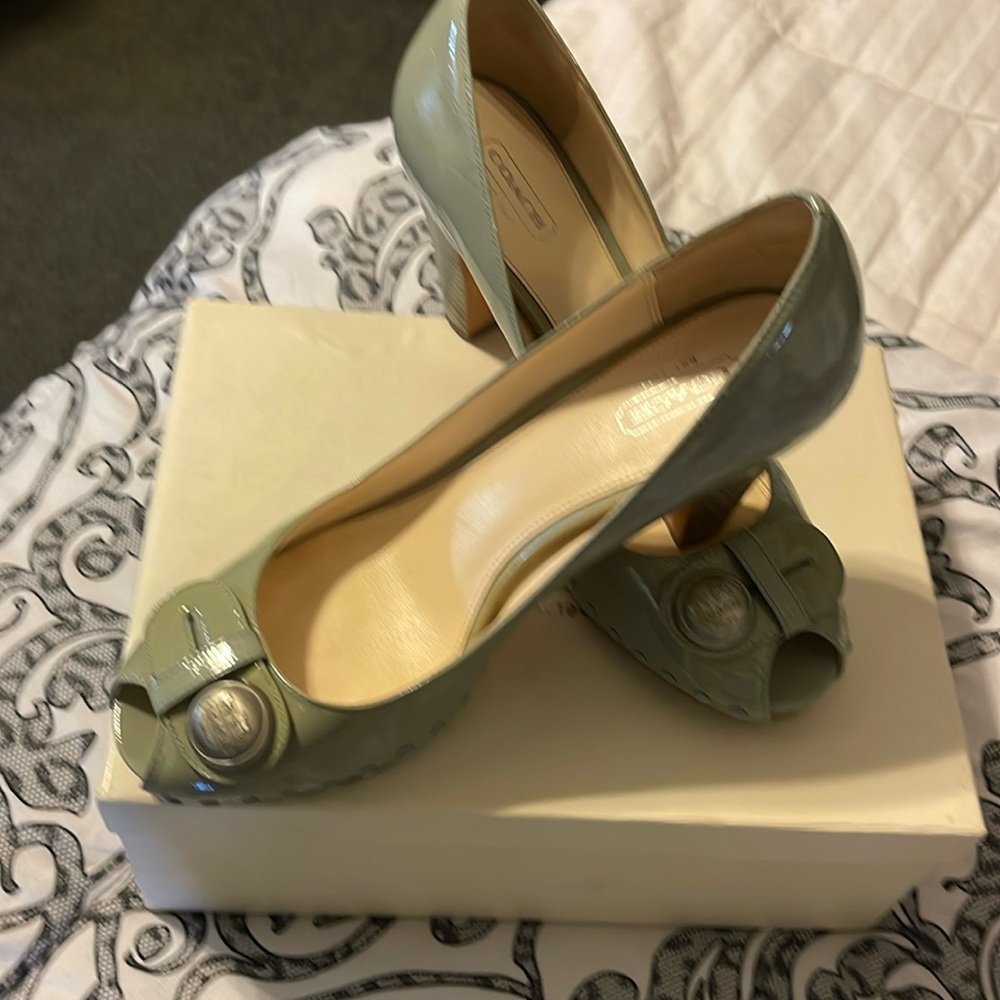 Coach genuine patent leather blue/grey in color. Goes with many outfits.